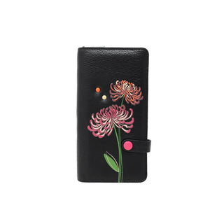 Black wallet with floral designs on a white background - okotoks hc pharmacy