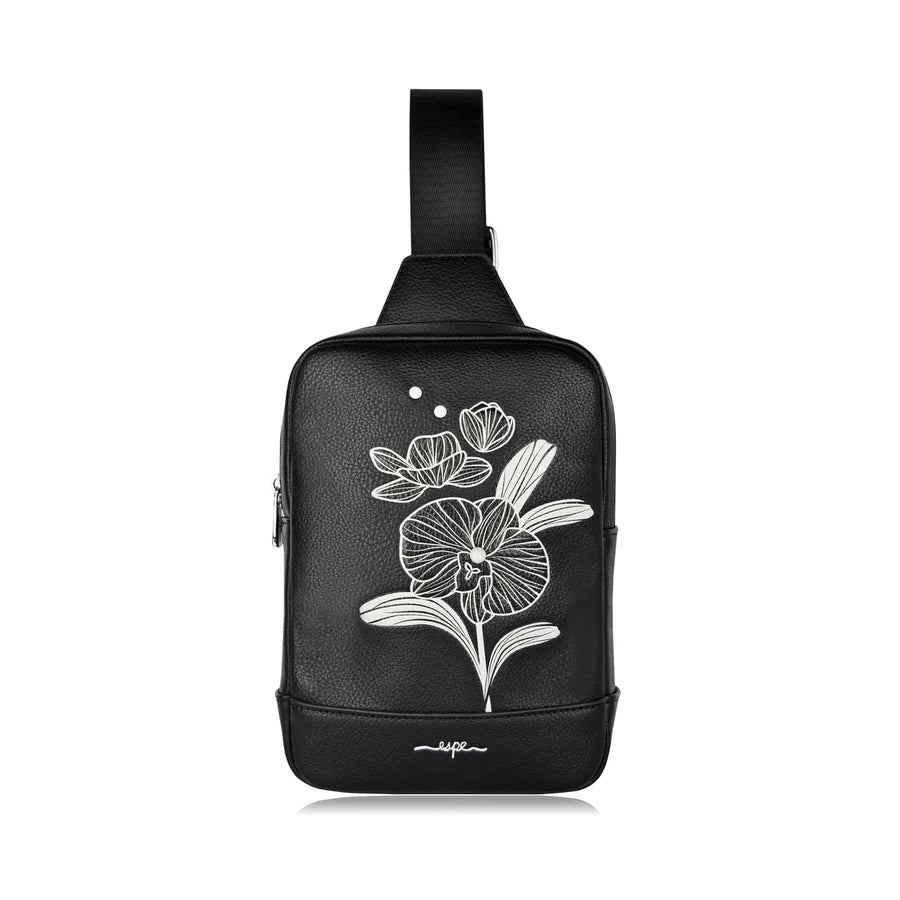 Black sling bag with white floral design on a white background - okotoks hc pharmacy