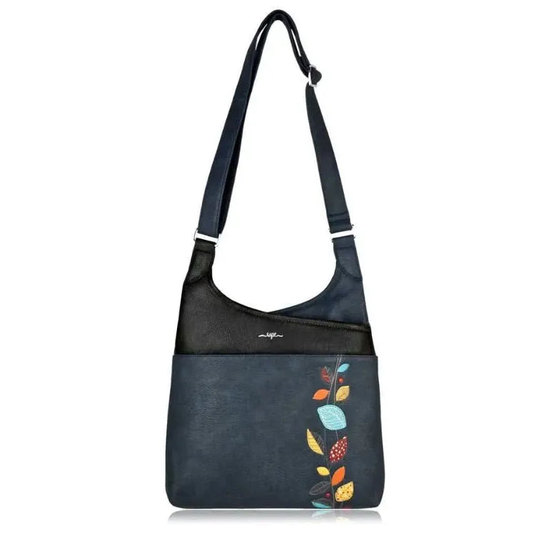 Blue shoulder bag with colorful leaf designs on a white background - okotoks hc pharmacy