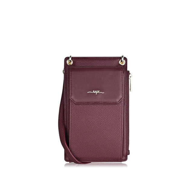 Purple crossbody bag with a visible brand logo on a white background - okotoks hc pharmacy