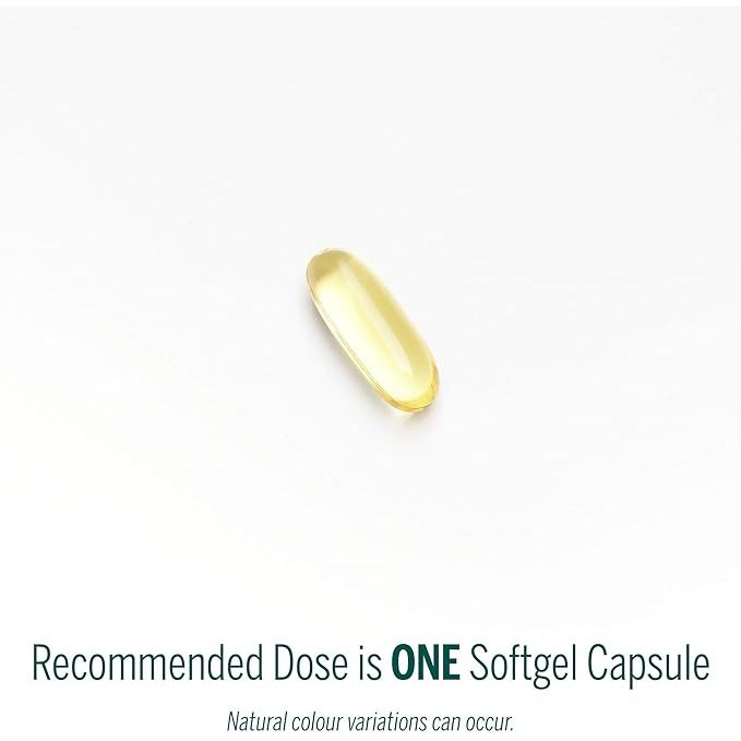 Yellow softgel capsule on a white background with text indicating the recommended dose. - okotoks hc pharmacy