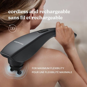 Person using a handheld massager on their shoulder with text indicating cordless and rechargeable features. - okotoks hc pharmacy