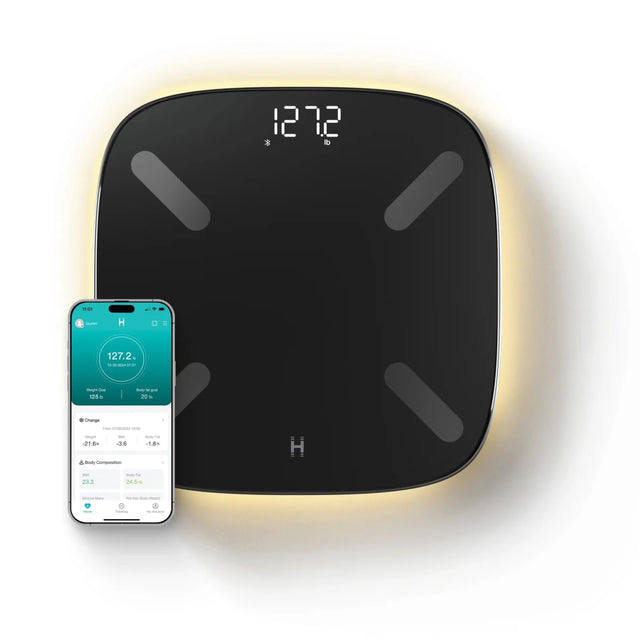 Smart scale with digital display and smartphone app on a white background. - okotoks hc pharmacy