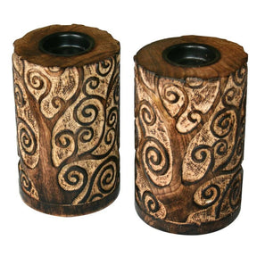 Two wooden candle holders with intricate carvings on a white background - okotoks hc pharmacy