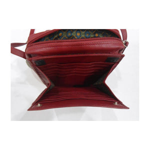 Red leather handbag with a patterned interior on a white background - okotoks hc pharmacy