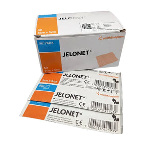Box and individual packages of Jelonet bandages by Smith & Nephew on a white background - okotoks hc pharmacy