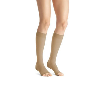 Beige knee-high socks worn by a person on a white background - okotoks hc pharmacy