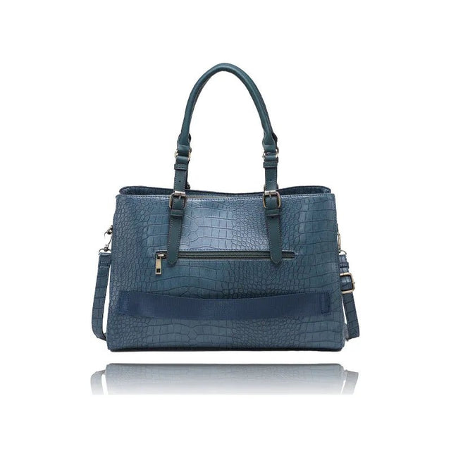 Blue textured handbag with multiple pockets and straps on a white background - okotoks hc pharmacy