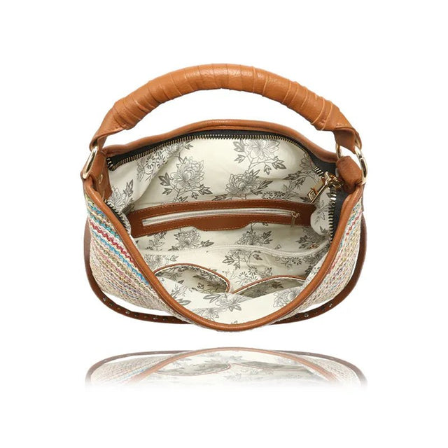 Brown handbag with floral interior on a white background - okotoks hc pharmacy