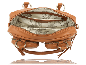 A tan leather shoulder bag shown open from the front, displaying its interior with a floral toile-patterned lining, multiple zippered compartments, and gold-tone hardware. - okotoks hc pharmacy