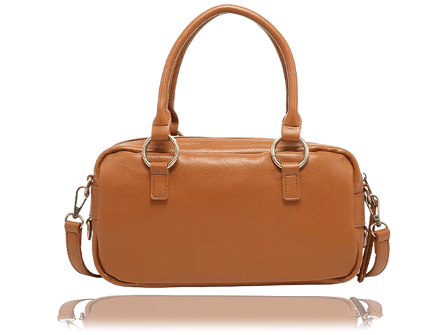 A tan leather handbag with double top handles, gold-tone hardware, and a detachable shoulder strap, shown against a plain white background with a soft reflection below. - okotoks hc pharmacy