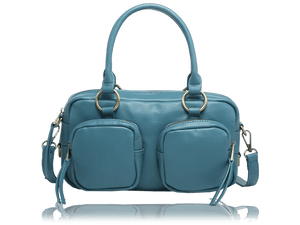 A teal blue leather handbag with dual top handles, two front zippered pockets, and gold-tone hardware, shown on a white background with a faint reflection below. - okotoks hc pharmacy