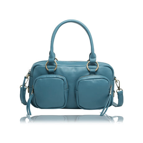 A teal blue leather handbag with dual top handles, two front zippered pockets, and gold-tone hardware, shown on a white background with a faint reflection below. - okotoks hc pharmacy