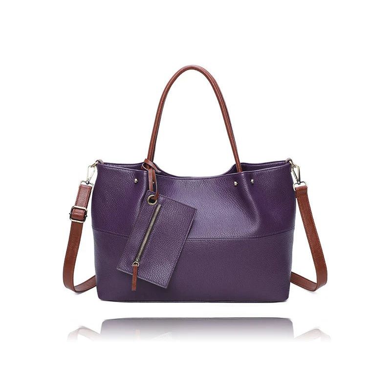Purple handbag with brown straps on a white background - okotoks hc pharmacy