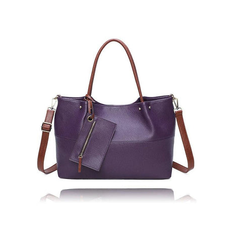 Purple handbag with brown straps on a white background - okotoks hc pharmacy