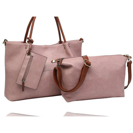 A dusty pink faux-leather tote bag with brown leather handles and a matching zippered pouch, displayed on a clean white background. - okotoks hc pharmacy