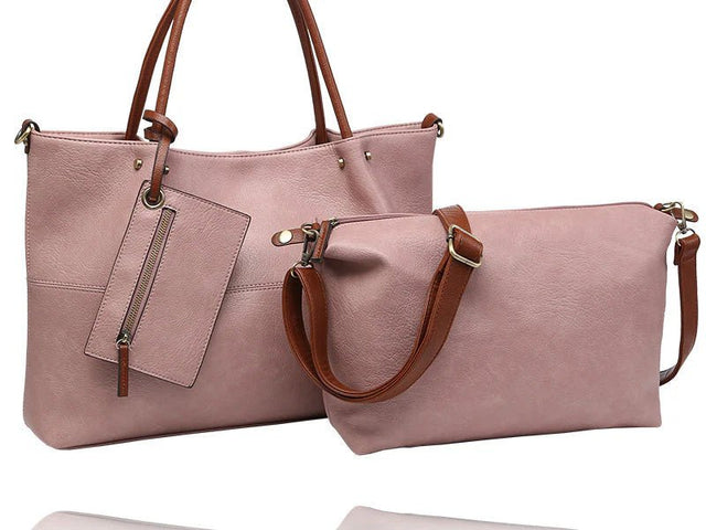 A dusty pink faux-leather tote bag with brown leather handles and a matching zippered pouch, displayed on a clean white background. - okotoks hc pharmacy