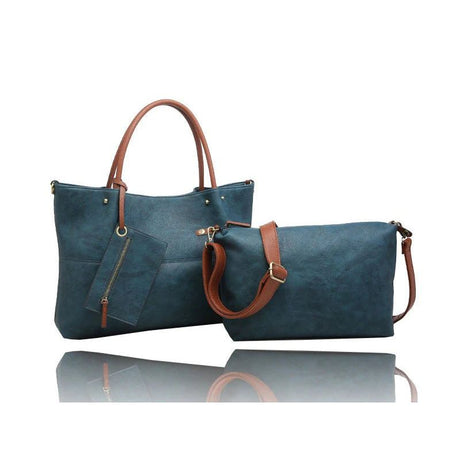 A matching two-piece handbag set consisting of a large tote bag and a smaller zippered pouch, both in a textured teal blue material with brown faux-leather handles and straps, displayed on a reflective white surface. - okotoks hc pharmacy