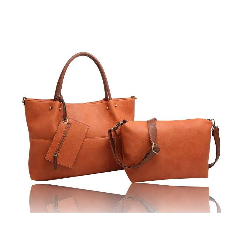 Brown leather handbag and clutch on a white background - okotoks hc pharmacy