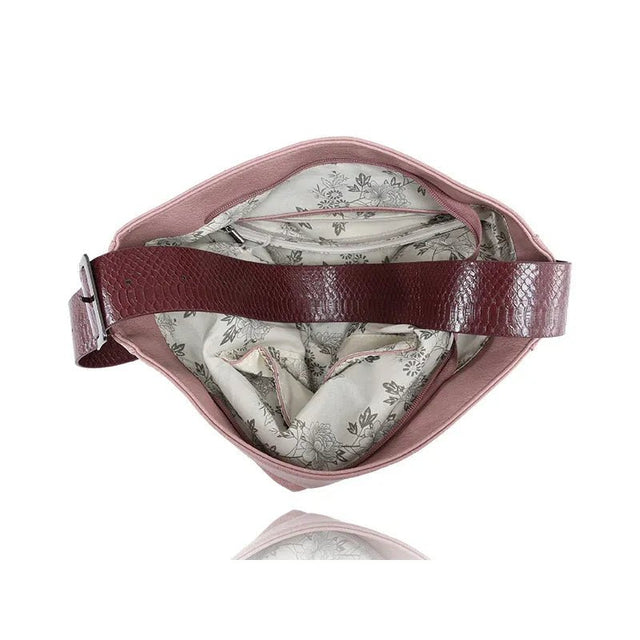 Pink handbag with floral interior on a white background - okotoks hc pharmacy