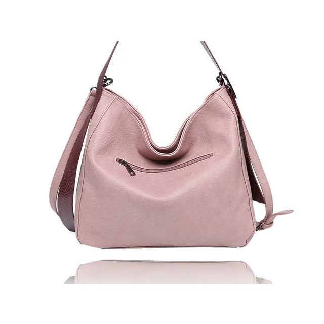 Pink handbag with a strap on a white background - okotoks hc pharmacy