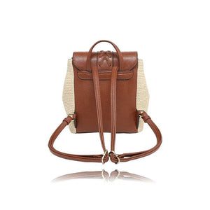 Brown leather and straw backpack on a white background - okotoks hc pharmacy