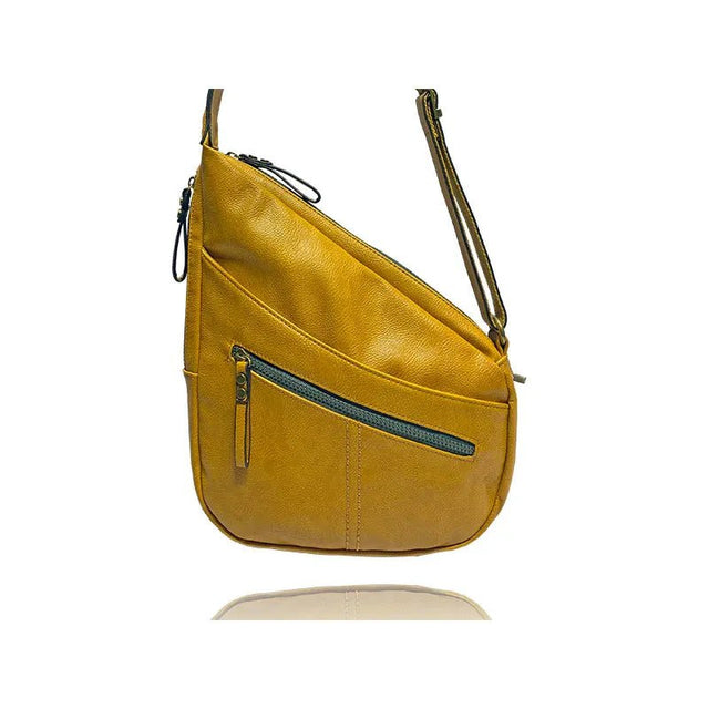 Yellow leather handbag with a shoulder strap on a white background - okotoks hc pharmacy