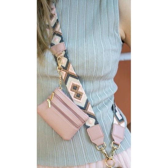 Pink wallet with a patterned strap worn by a person - okotoks hc pharmacy