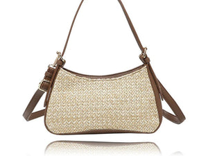 A woven straw shoulder bag with brown leather trim and straps, shown against a plain white background with a subtle reflection. - okotoks hc pharmacy