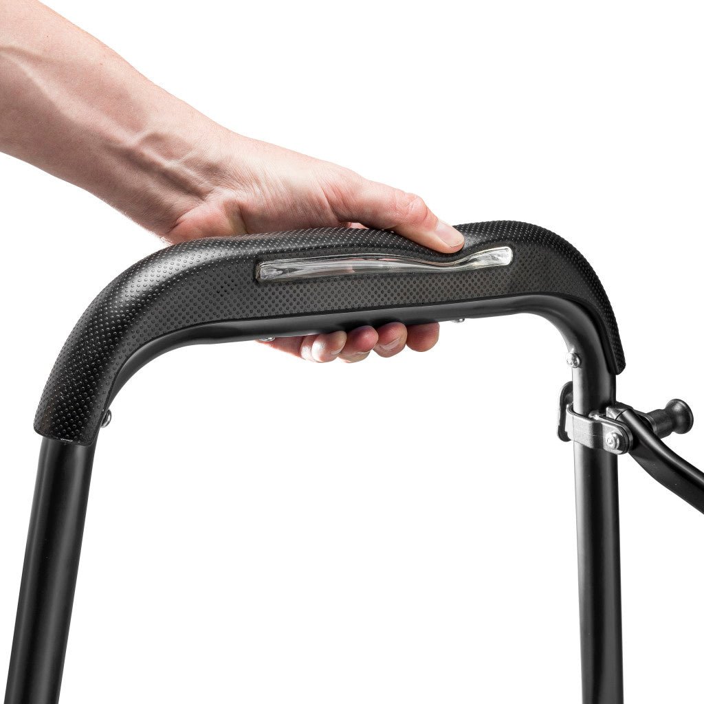 Hand holding a black handlebar with a white background - okotoks hc pharmacy
