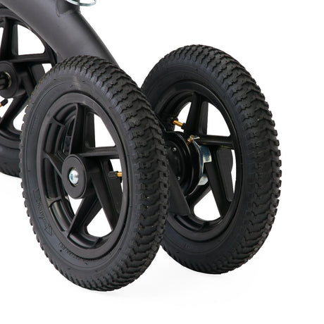 Close-up of black wheels on a knee walker with a white background - okotoks hc pharmacy
