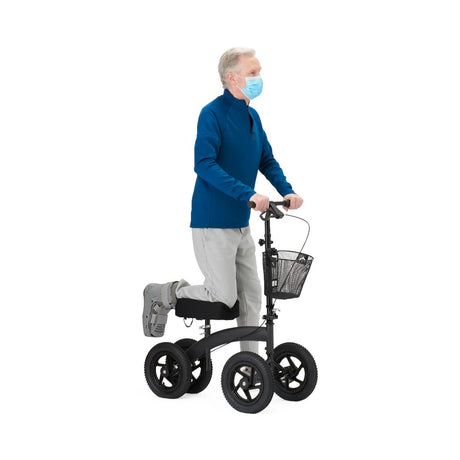 Person using a knee walker with a basket on a white background - okotoks hc pharmacy