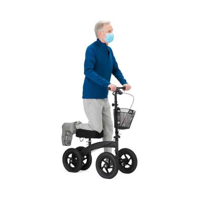 Person using a knee walker with a basket on a white background - okotoks hc pharmacy