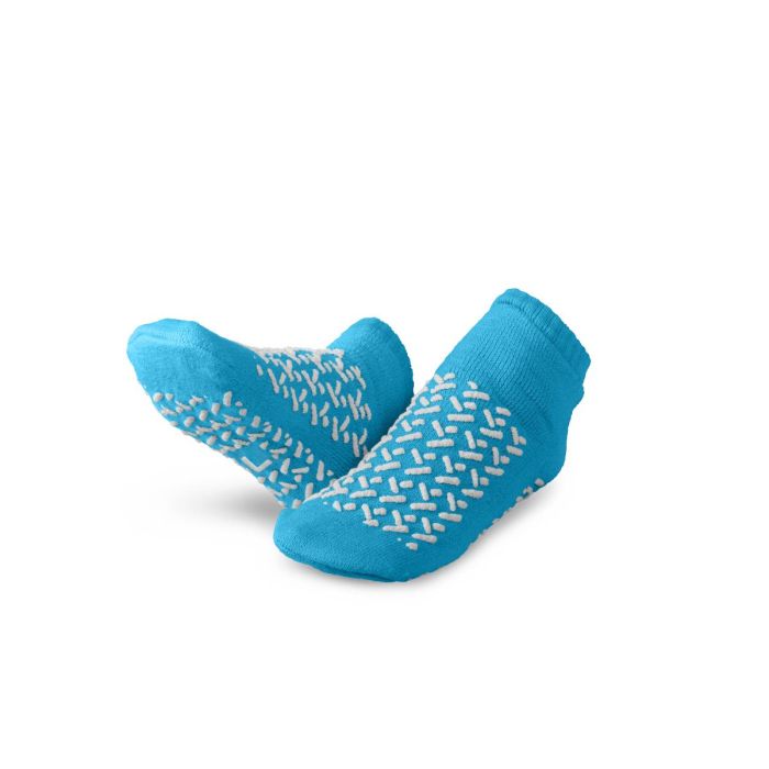 A pair of bright blue low-cut socks with white grip patterns on the soles and sides, displayed against a clean white background. - okotoks hc pharmacy