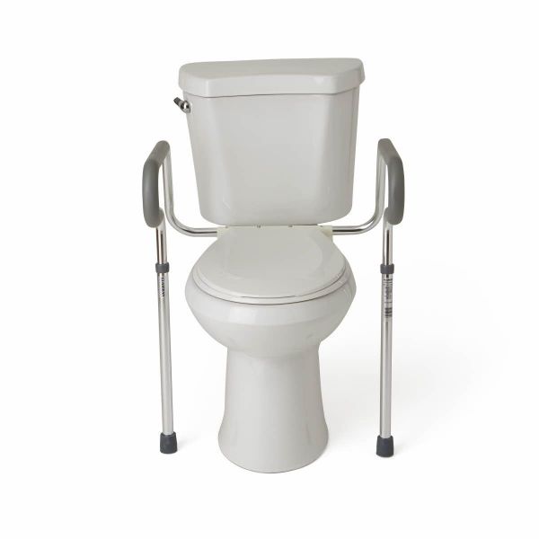 White toilet with a metal frame attached for support on a white background - okotoks hc pharmacy