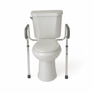 White toilet with a metal frame attached for support on a white background - okotoks hc pharmacy