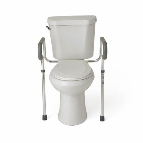 White toilet with a metal frame attached for support on a white background - okotoks hc pharmacy