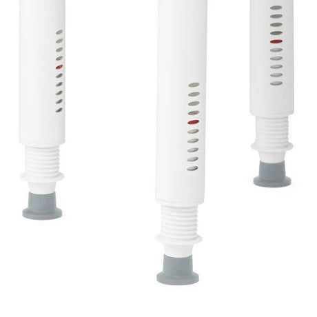 Three white cylindrical objects with gray bases on a white background - okotoks hc pharmacy