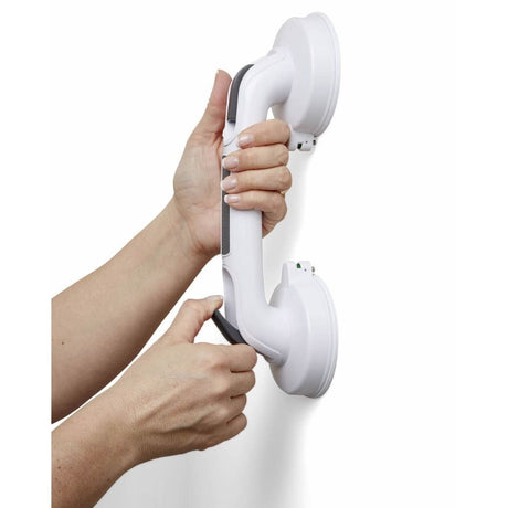 White handheld shower head held by a person against a white background - okotoks hc pharmacy