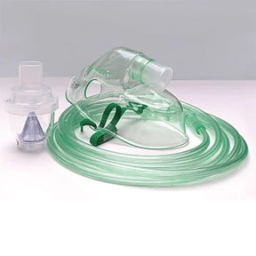 Clear plastic oxygen mask with green tubing on a white background - okotoks hc pharmacy