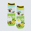 Children's socks with bee and flower design on a light blue background - okotoks hc pharmacy