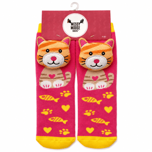 A pair of children's novelty socks in pink packaging, featuring 3D orange-and-cream striped cat faces on the front, with yellow fish, hearts, and paw prints on a bright pink background. - okotoks hc pharmacy