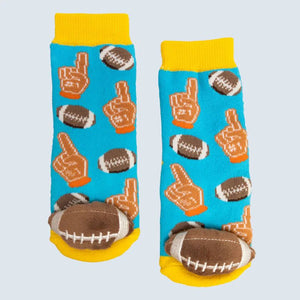 Pair of socks with foam finger and football designs on a light blue background - okotoks hc pharmacy