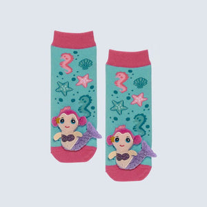 Pair of socks with mermaid design on a light gray background - okotoks hc pharmacy
