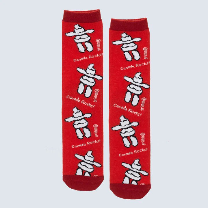 Red socks with white Inukshuk designs and 'Canada Rocks!' text on a light gray background - okotoks hc pharmacy
