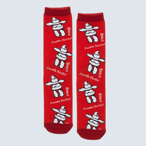 Red socks with white Inukshuk designs and 'Canada Rocks!' text on a light gray background - okotoks hc pharmacy