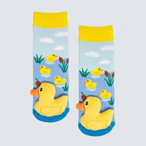 Pair of socks with rubber duck design on a light blue background - okotoks hc pharmacy
