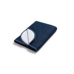 Folded navy blue underpad with white interior on a white background - okotoks hc pharmacy