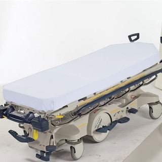 Medical stretcher with a white sheet on a white background - okotoks hc pharmacy