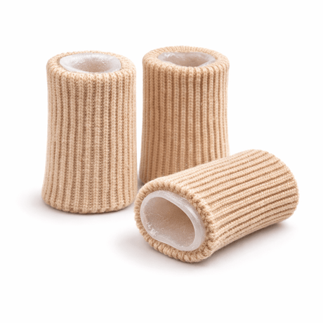Three rolls of beige elastic bandage on a white background - okotoks hc pharmacy